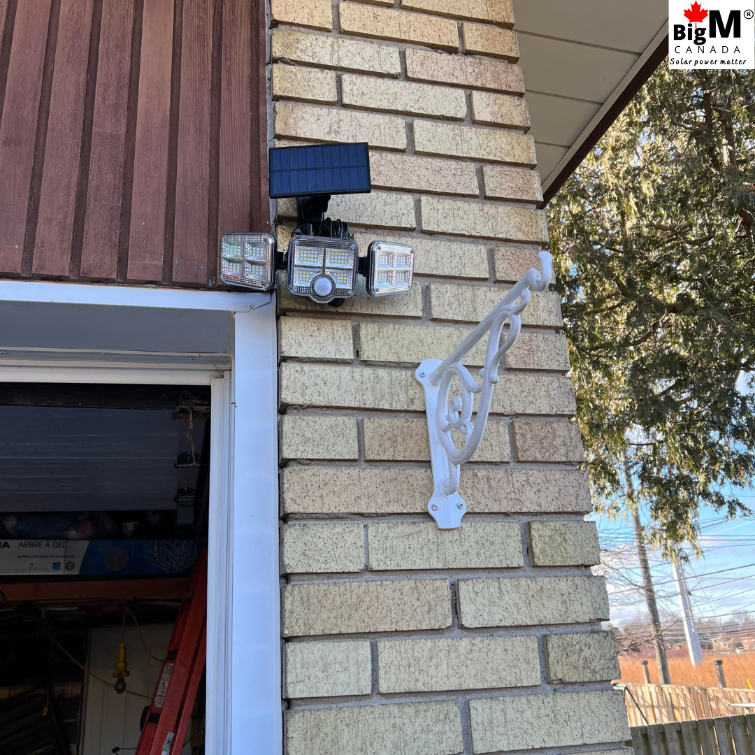 BigM 122 LED solar security motion sensor light is installed above the garage doors