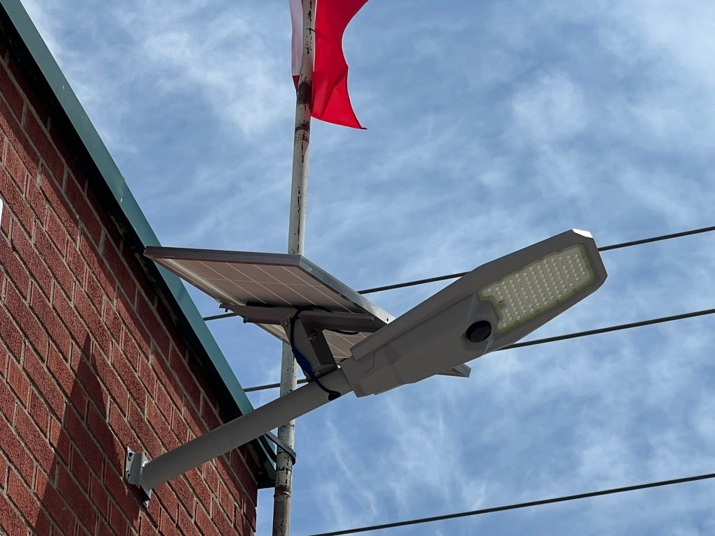 BigM 600W aluminum solar street light with motion sensor & adjustable panel Is installed at the exterior of a commercial building at Woodstock, Ontario.