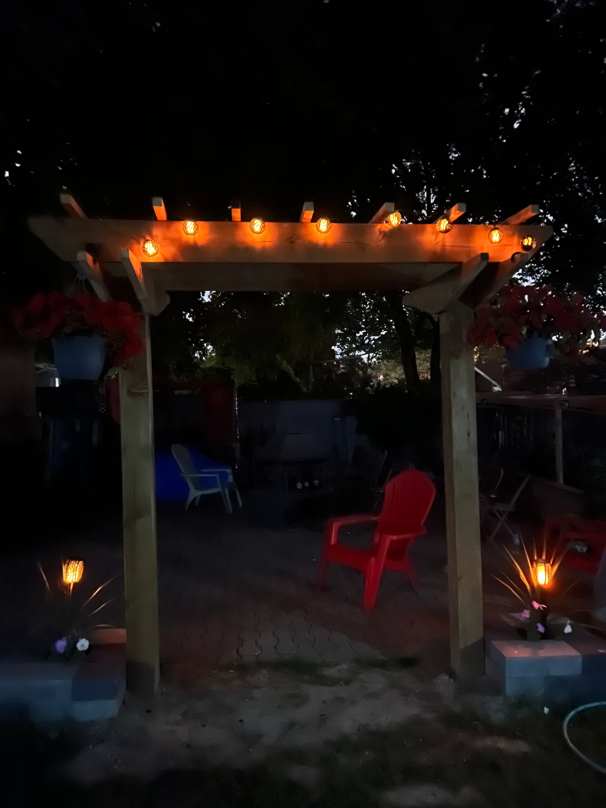 BigM solar flickering flame light balls set are installed on a pergola and creates a stunning fiery view