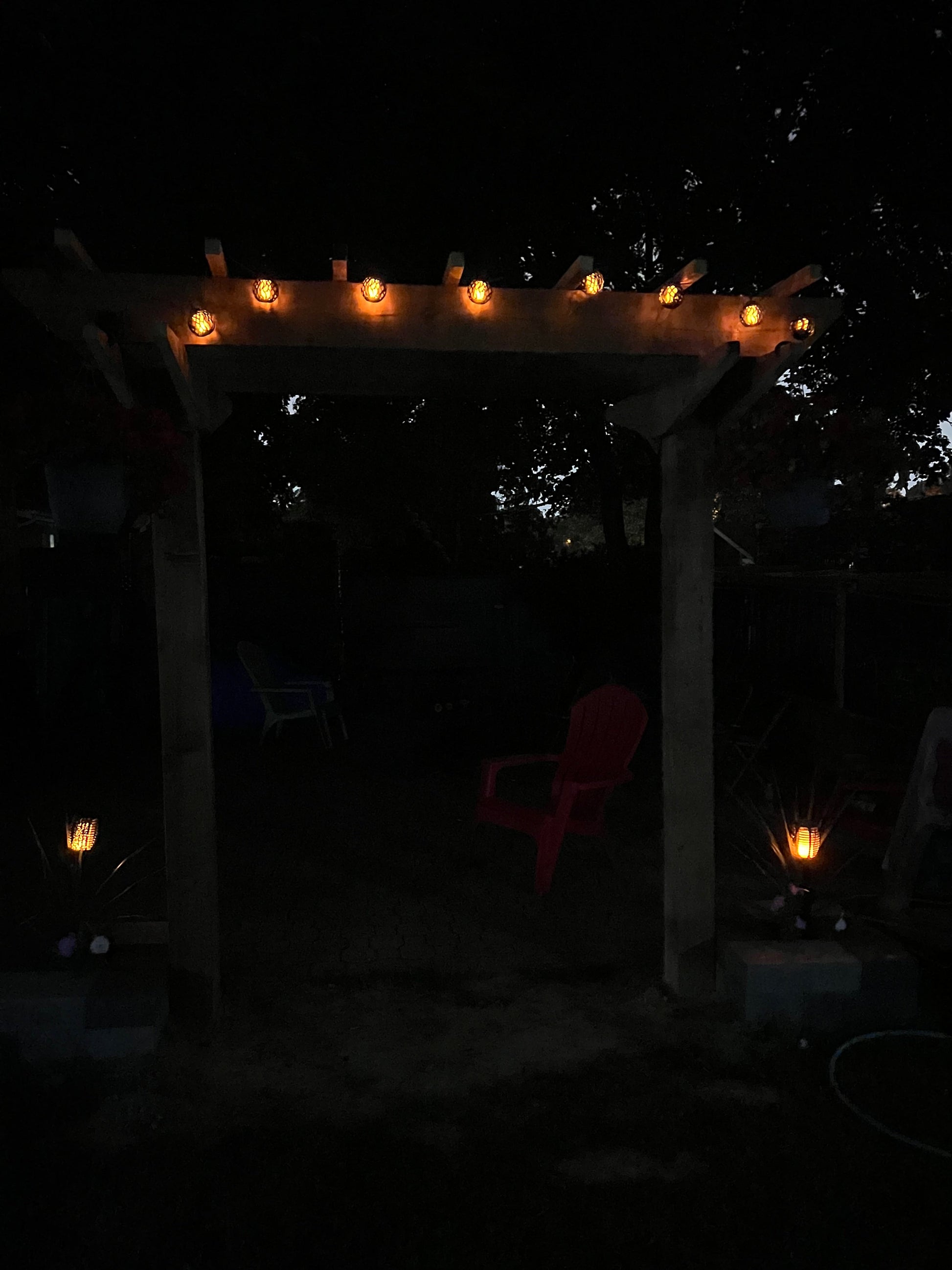 BigM solar flickering flame light balls set are installed on a pergola