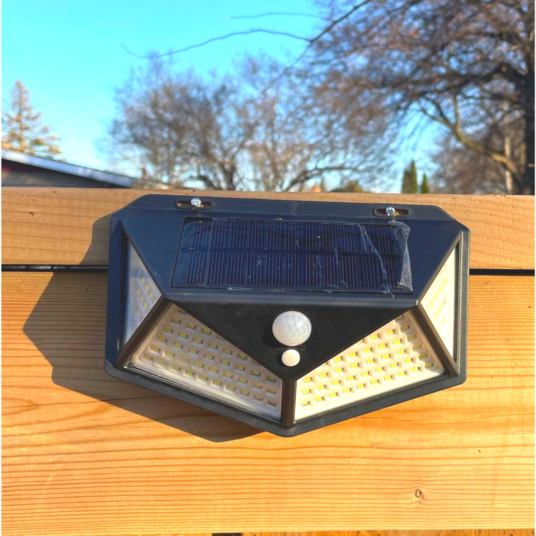 Front view of BigM Super Bright 114 LED Solar Motion Sensor Lights installed on a deck