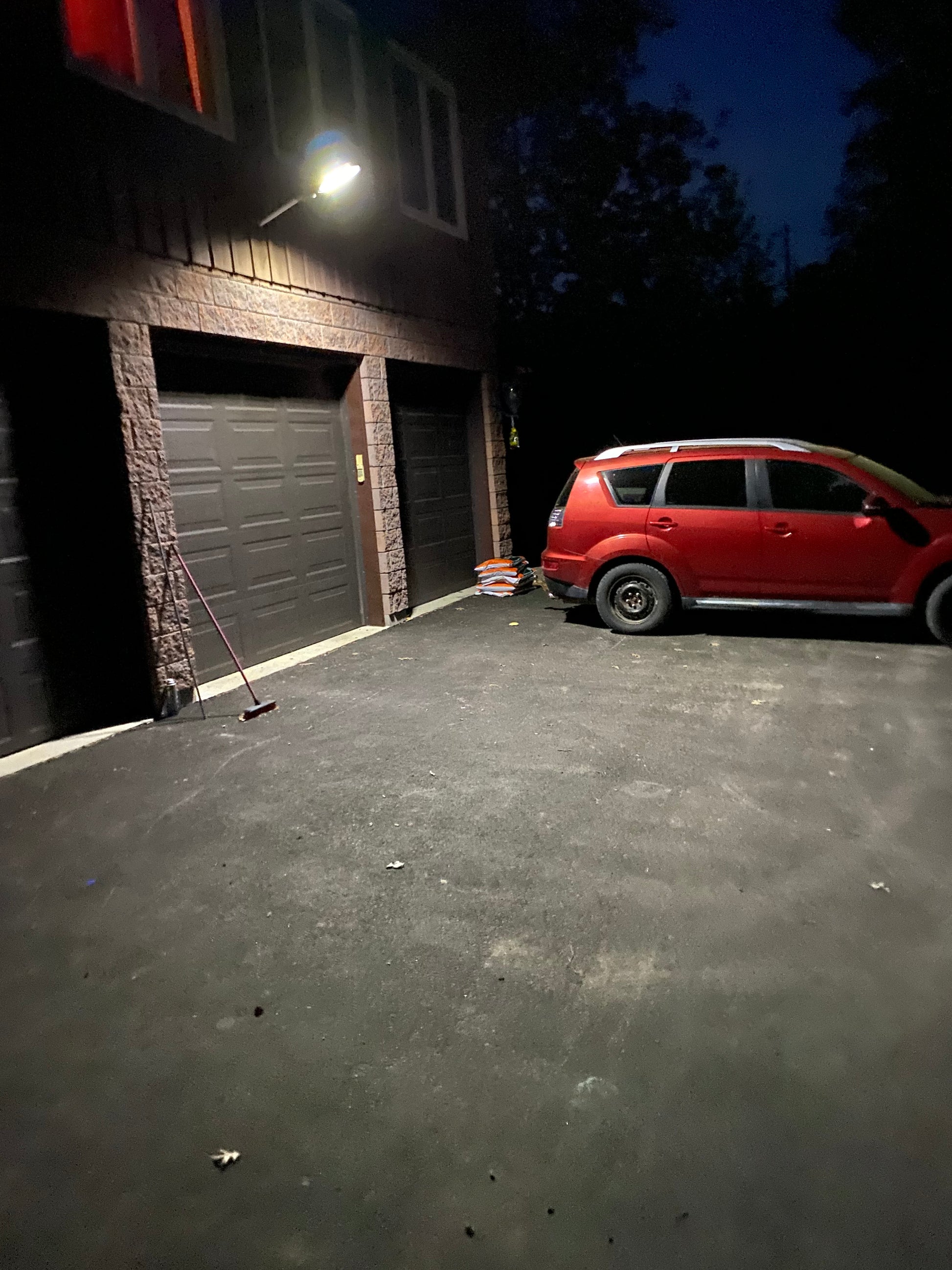 Customer installed a BigM Heavy Duty 500W Solar Flood above a 3 doors garage