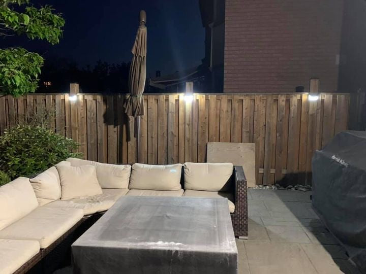 BigM  212 LED Solar Light are installed on the fence posts  around a patio