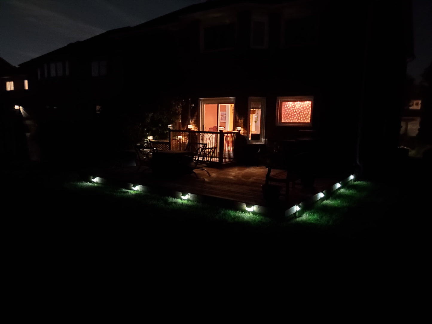 BigM  212 LED Solar Security Light  installed around deck of a trailer house. Lights are on in low mode at this moment in the picture. This low mode will turn bright when sensing motion