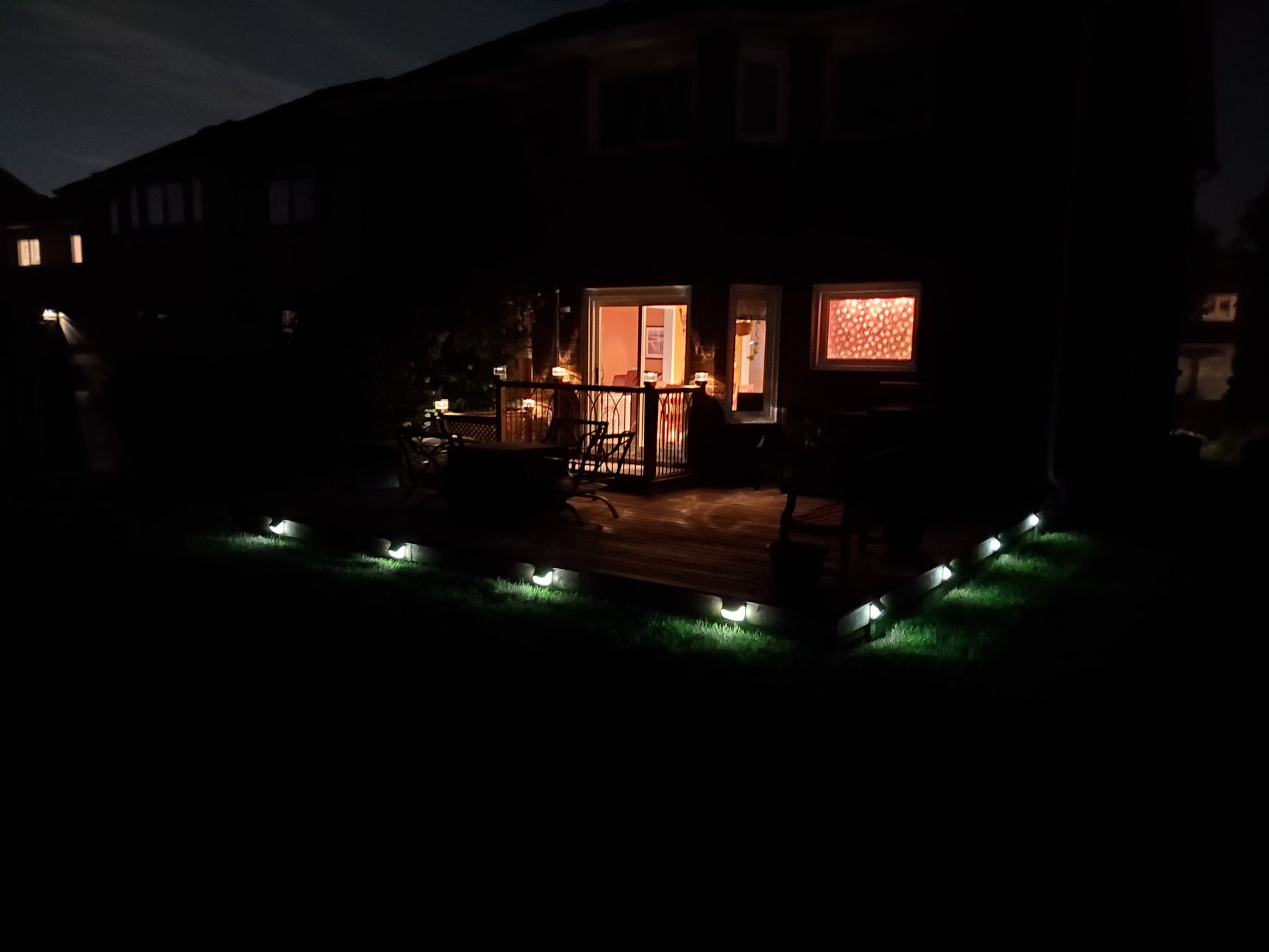 BigM  212 LED Solar Security Light  installed around deck of a trailer house. Lights are on in low mode at this moment in the picture. This low mode will turn bright when sensing motion