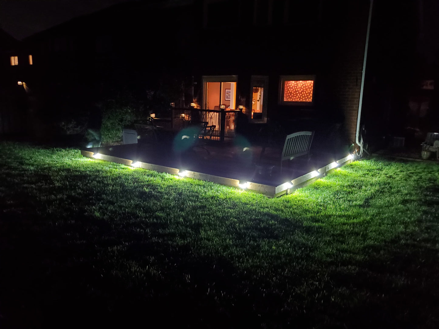 BigM  212 LED Best Solar Light With Motion Sensor installed around deck of a trailer house and generates bright light after dusk till dawn