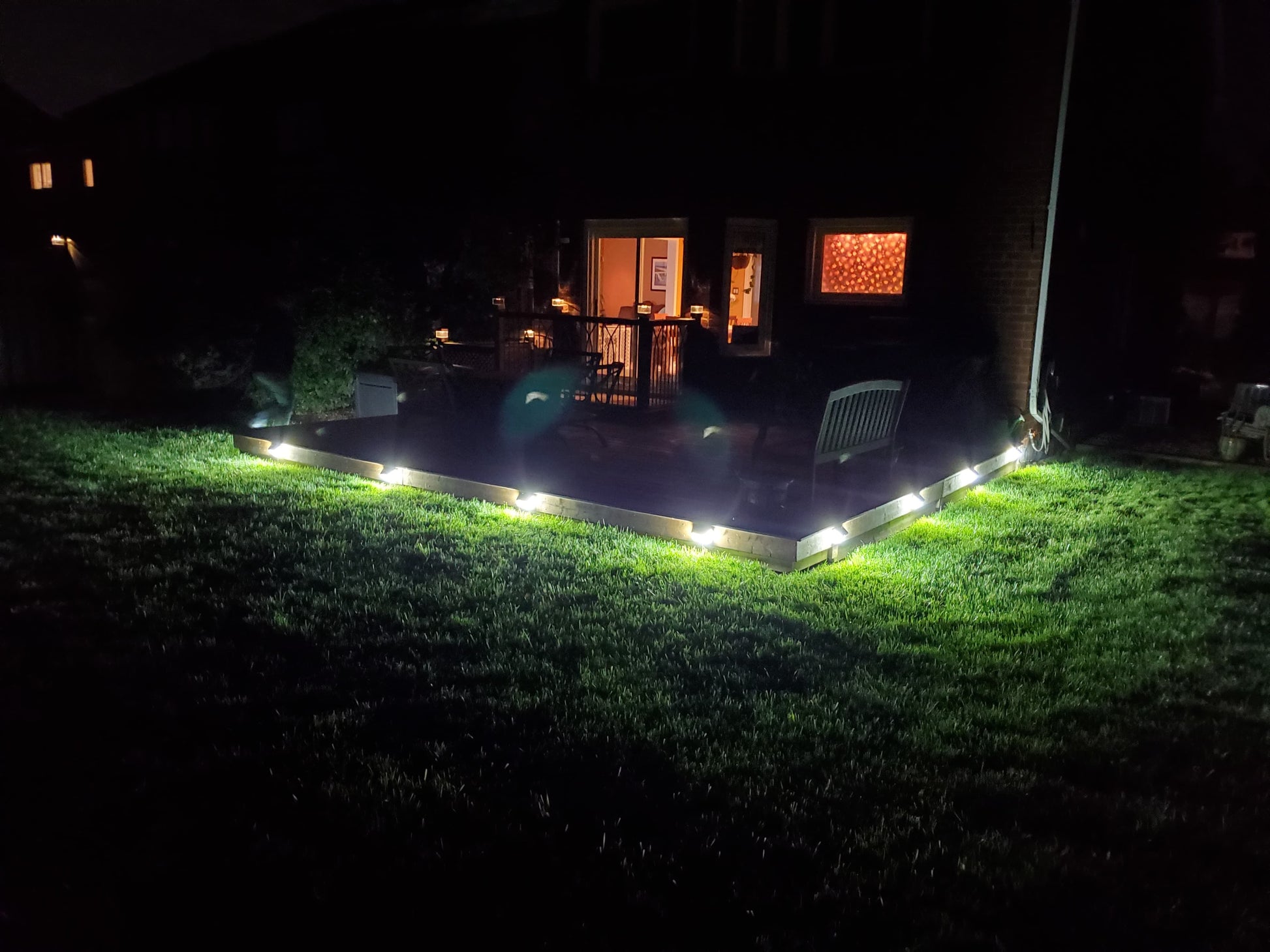 BigM  212 LED Best Solar Light With Motion Sensor installed around deck of a trailer house and generates bright light after dusk till dawn