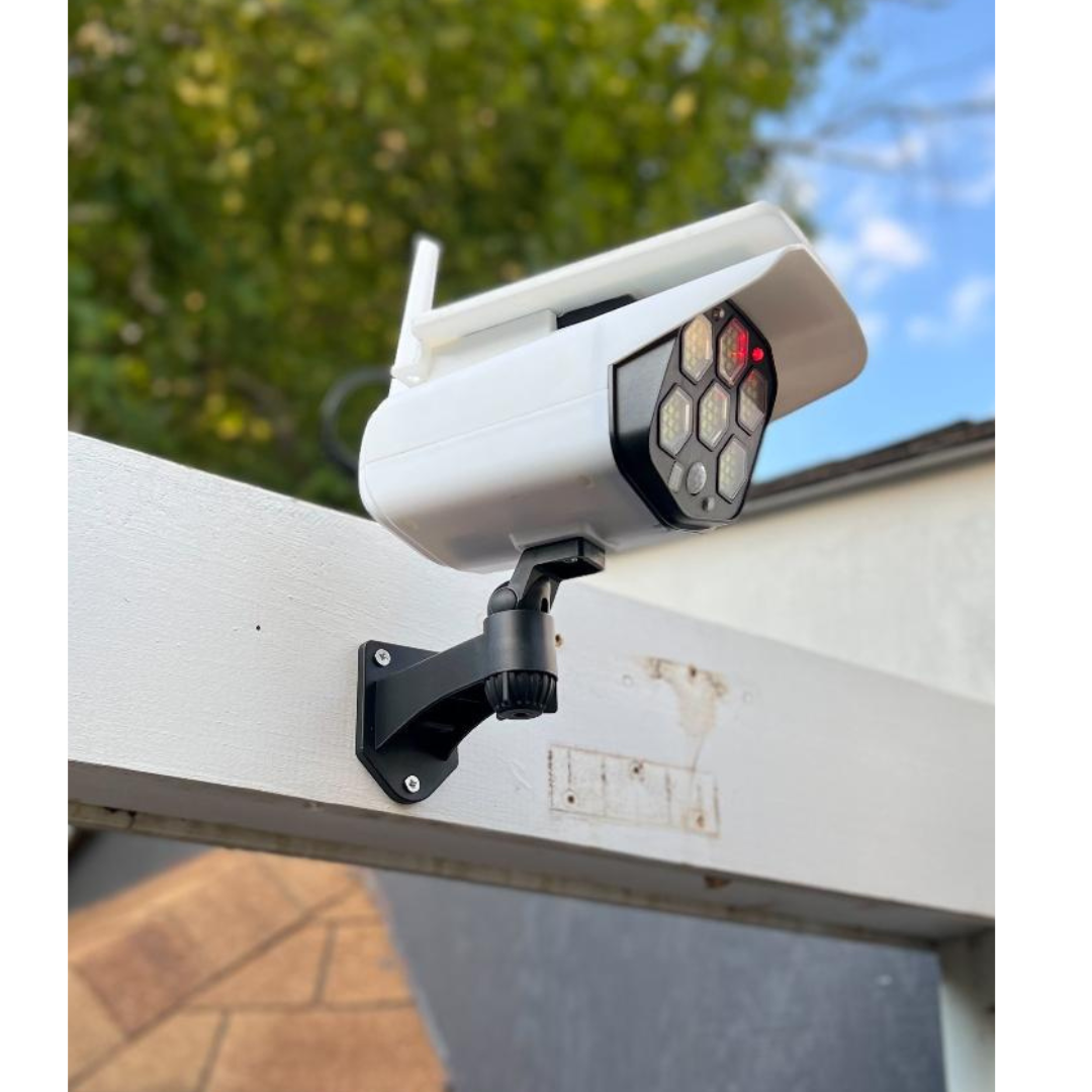 BigM Solar Fake Security Camera Floodlight is installed above a door