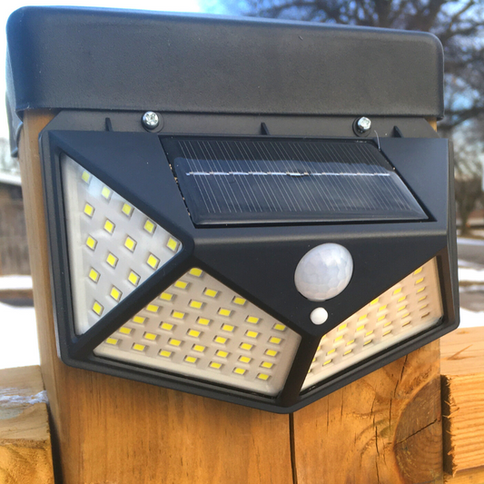 BigM Super Bright Wireless 100 LED Solar Light with Motion Sensor mounted on outdoor post.