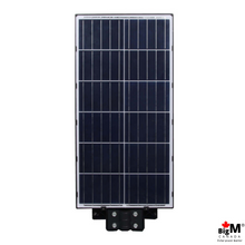 Charger l&#39;image dans la galerie, BigM 1200W solar commercial street light has a large high efficiency solar panel that absorbs sunlight during day time and charge the battery sufficiently to light up for all night
