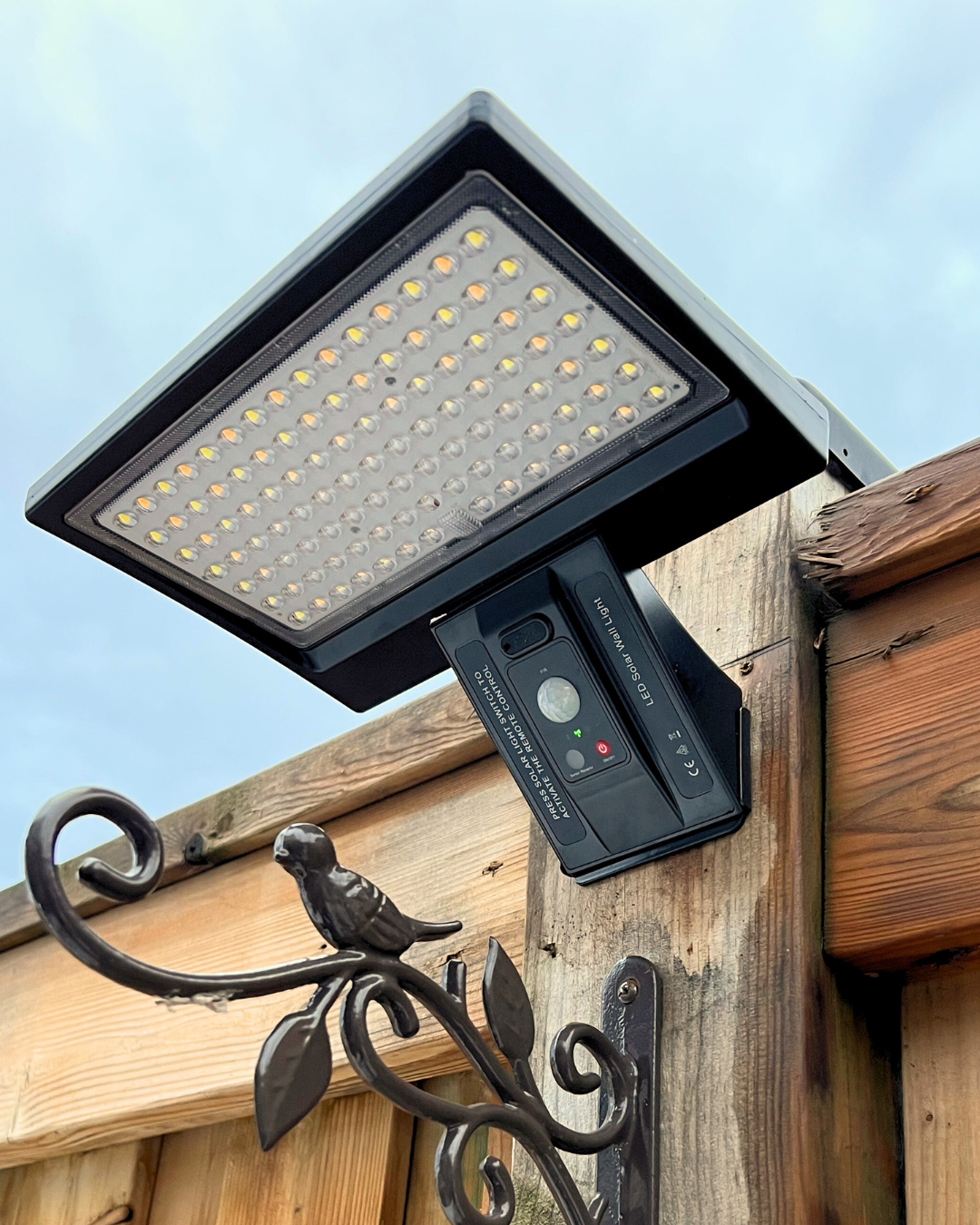 BigM Solar Wall Lamp for Outdoor Security with Motion Sensor also works in steady lighting mode