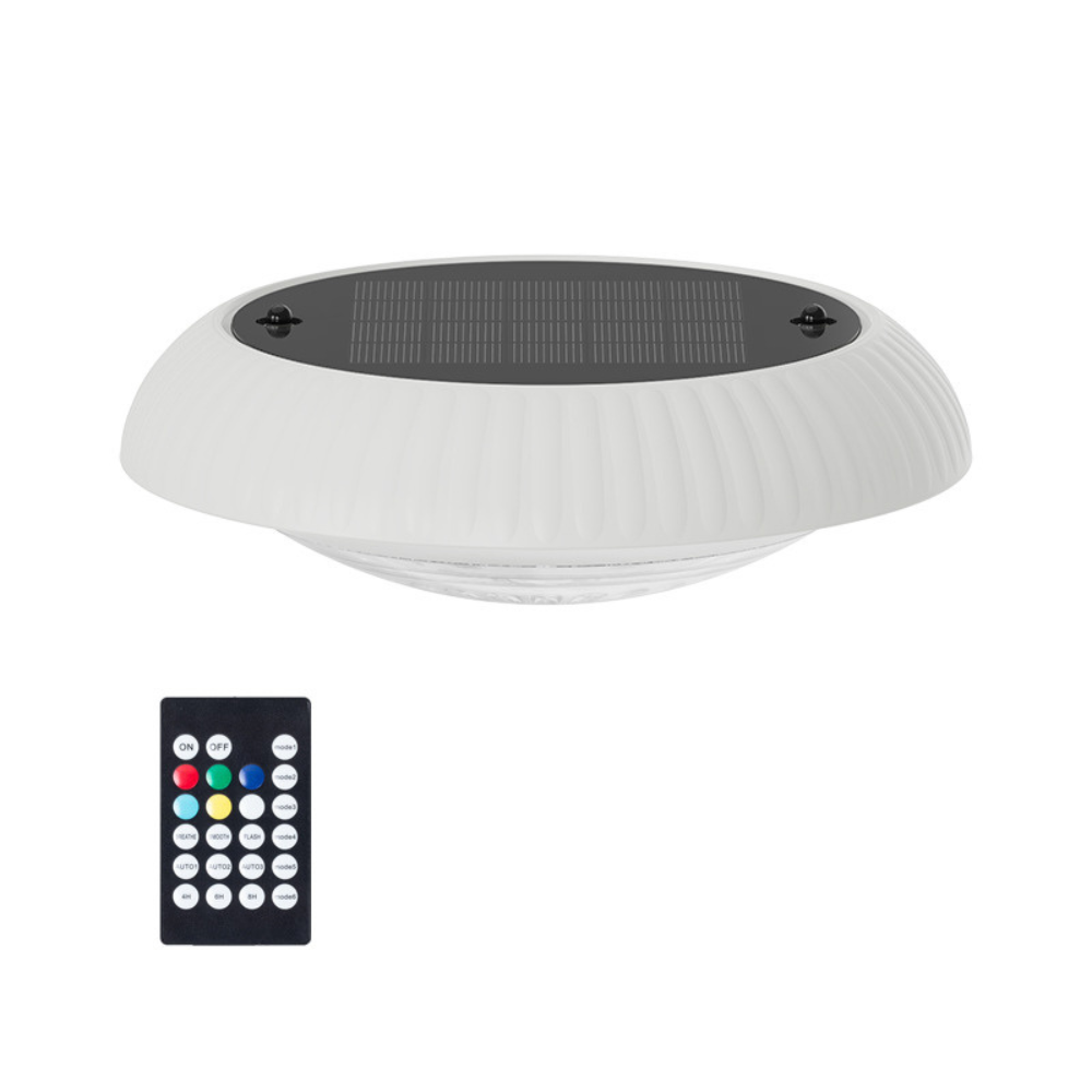 White UFO-shaped BigM Solar LED Floating Pool Light with solar panel and remote control on a white background