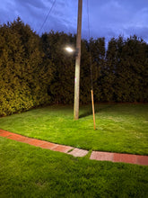 Charger l&#39;image dans la galerie, BigM 400W Solar Flood Lights with Motion Sensor for Outdoors installed on hydro pole at a country side house at PEI generates bright light at night
