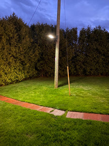 BigM 400W Solar Flood Lights with Motion Sensor for Outdoors installed on hydro pole at a country side house at PEI generates bright light at night