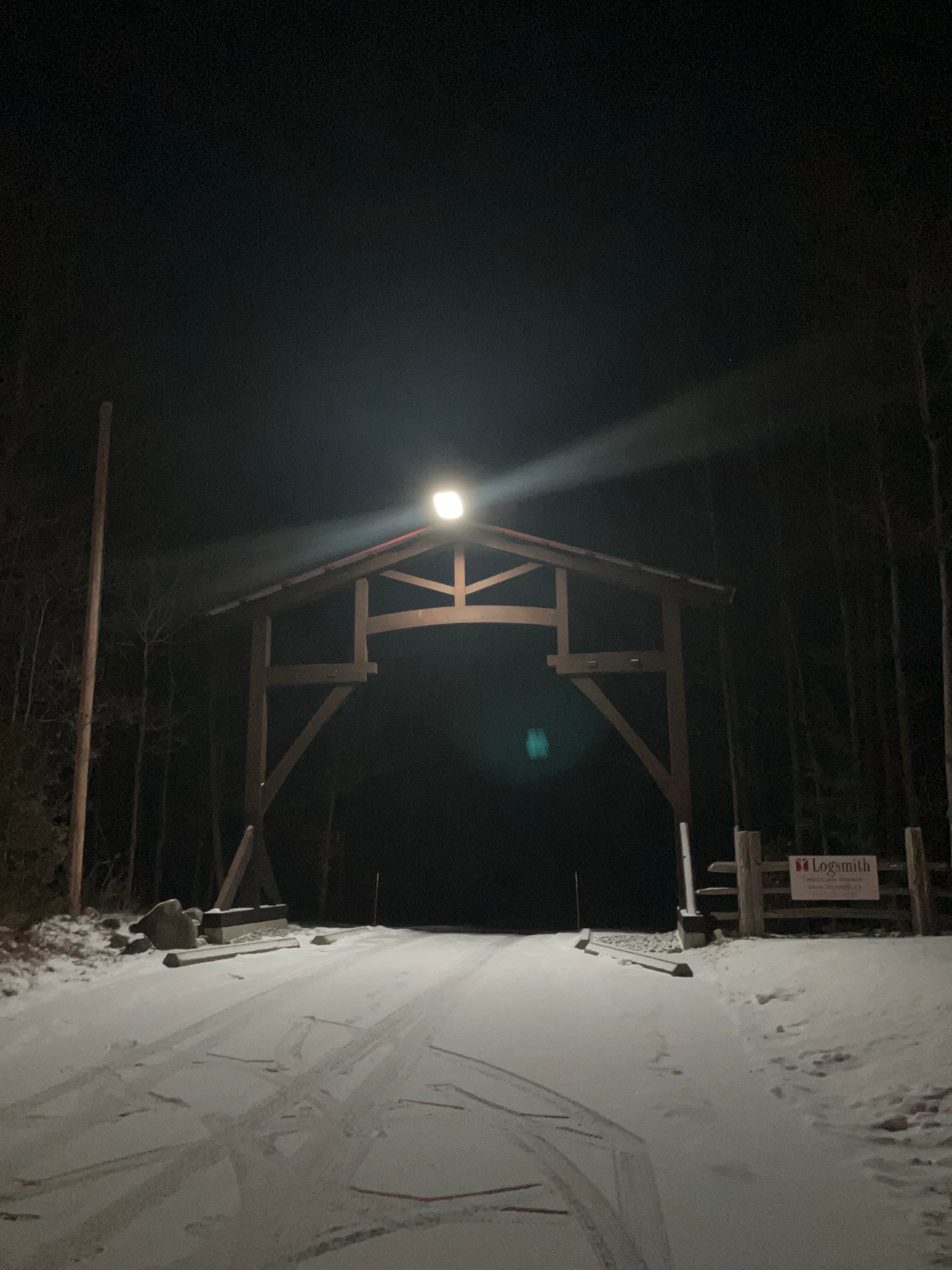 Image of BigM 1200W solar commercial street lights that installed on a roadway to a farm and shining at winter night in Ontario, Canada (photo courtesy BigM customer)