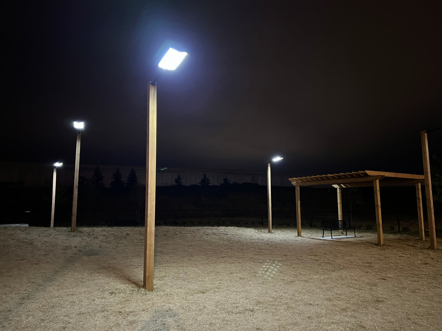 BigM 1200W solar commercial street lights are installed on a 6x6’ 16 ft tall pressure treated wooden post at a Loblaw’s dog park at Barrie, Ontario
