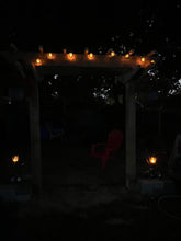 Load image into Gallery viewer, BigM solar flickering flame light balls set are installed on a pergola
