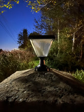 Load image into Gallery viewer, BigM Elegant Looking Bright LED Solar Post Lights installed on a stone pillar on a driveway 
