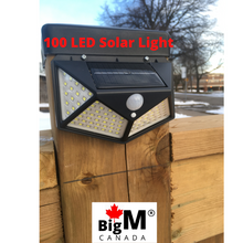 Load image into Gallery viewer, Image of a BigM Super Bright Wireless 100 LED Solar Lights with Motion Sensor can be installed on the walkway of a house
