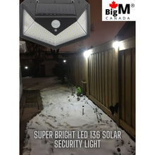 Load image into Gallery viewer, BigM Bright 136 LED Solar Security Light with Motion Sensor lights up a pathway at night
