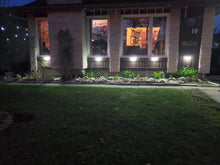 Load image into Gallery viewer, Image of a BigM Super Bright Wireless 100 LED Solar Lights installed at the front of a house
