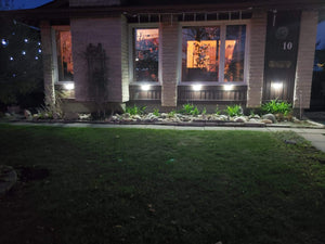 Image of a BigM Super Bright Wireless 100 LED Solar Lights installed at the front of a house
