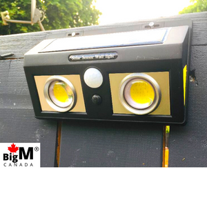 BigM 1000 Lumens Super Bright Outdoor Solar Lights with Motion Sensor is installed on a fence post