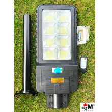 Load image into Gallery viewer, Image of BigM 400W Solar Street Light with remote, metal bracket, instruction manual

