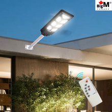 Charger l&#39;image dans la galerie, Image of BigM 700w solar parking lot lights installed at the front of a house
