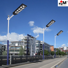 Load image into Gallery viewer, BigM 900W Commercial Grade Solar Street Lights are installed on  pathways
