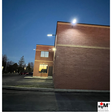 Load image into Gallery viewer, BigM 500w and 900w led solar street lights installed around a commercial building
