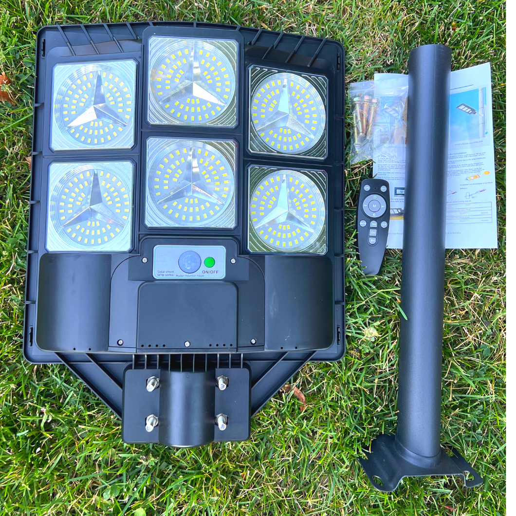 Image of a BigM Heavy Duty 600W LED Best Solar Street Lights with a metal wall mount, remote, screws
