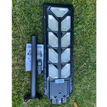 Load image into Gallery viewer, Image of BigM 900W Commercial Grade Solar Street Lights  with metal pole, remote, hardwares &amp; instruction manual
