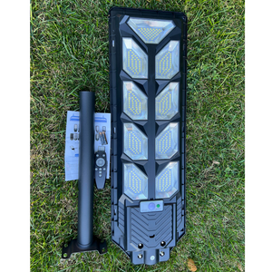 Image of BigM 900W Commercial Grade Solar Street Lights  with metal pole, remote, hardwares & instruction manual