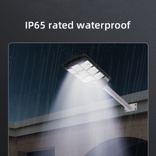 Load image into Gallery viewer, BigM 900W LED Commercial Solar Flood Lights are IP65 waterproof and survives through Canadian harsh winter weather

