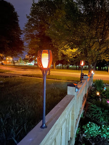BigM 96 LED Solar Flickering Dancing Flame Lights with Wall mount is installed above a wall