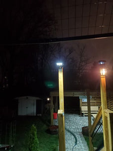 Night view of BigM 100 w street light that being installed by customer on a deck at their cottage
