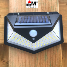 Load image into Gallery viewer, BigM Bright 136 LED Solar Security Light with Motion Sensor installed on a fence post
