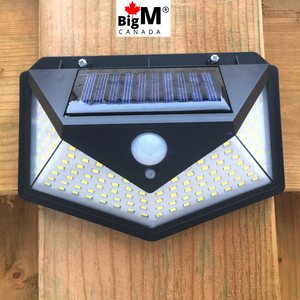 BigM Bright 136 LED Solar Security Light with Motion Sensor installed on a fence post