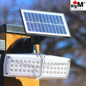 BigM 5000 Lumens Best Motion Sensor Solar Light for Outdoors Driveways is installed on a driveway of a house